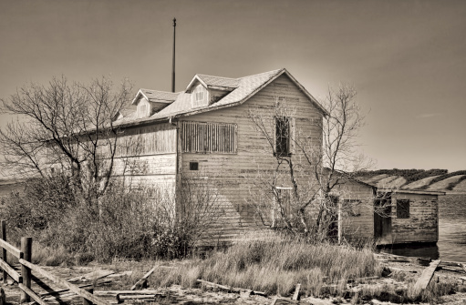 Black and white image of abandoned hotel at Manitou Beach, Saskatchewan.