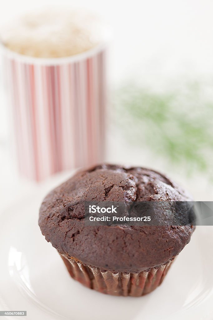 Chocolate muffin with cappuccino coffee Chocolate muffin with cappuccino coffee. Shallow depth of field. Cappuccino Stock Photo