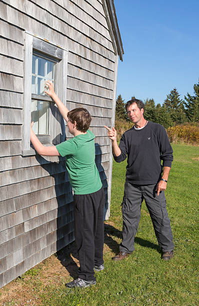 istock Father rebuked his son breaking into old house 450671297