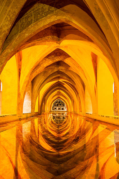Alcazar Queen Baths Alcázar of Seville - front view reflections Baths of Lady Maria de Padilla in Seville, Spain alcazares reales of sevilla stock pictures, royalty-free photos & images