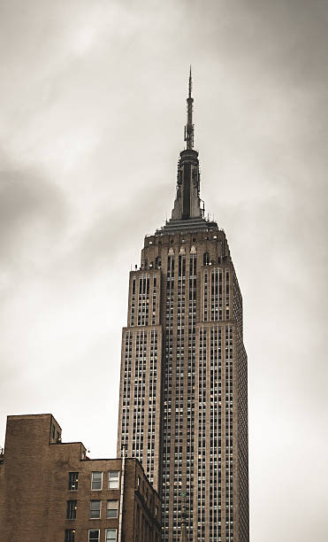 istock the empire state building on cloudy day 450671801