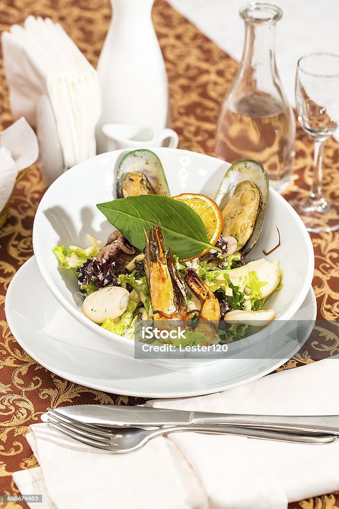 salad with vegetables and seafood salad with vegetables and seafood on the table in a restaurant Anchovy Stock Photo