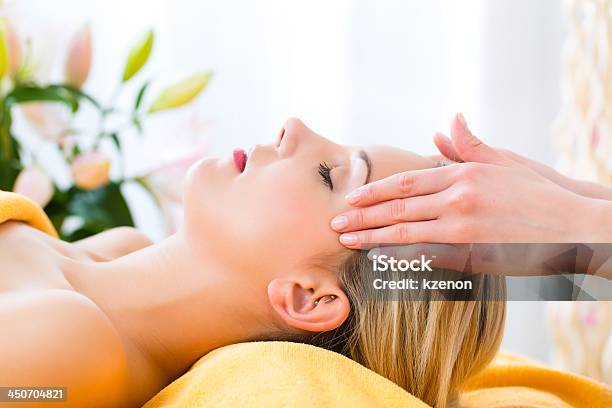 A Women Receiving A Head Massage In A Spa Stock Photo - Download Image Now - Reiki, Alternative Therapy, Bodysuit