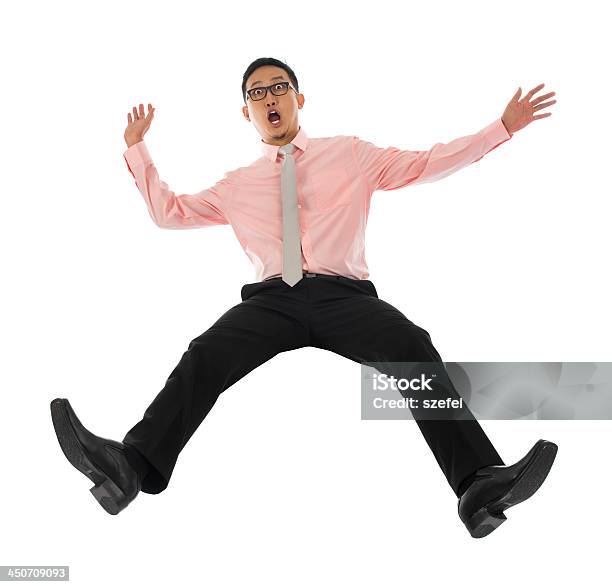 Asian Businessman Falling Backwards Stock Photo - Download Image Now - Falling, Bending Over Backwards, Men