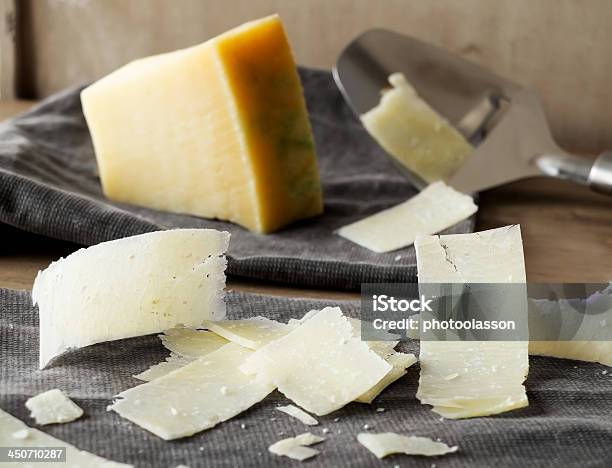 Parmesan Cheese Slices Stock Photo - Download Image Now - Parmesan Cheese, Wood Shavings, Grater - Utensil
