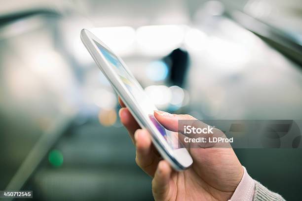 Woman Using Her Cell Phone In Subway On Escalator Stock Photo - Download Image Now - Adult, Adults Only, Business