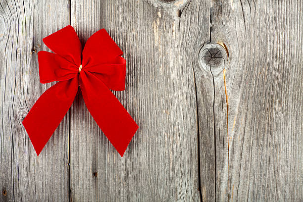 istock Christmas Greeting with a red Ribbon Bow 450712869