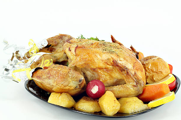 istock roasted chicken with potatoes on plate 450713615