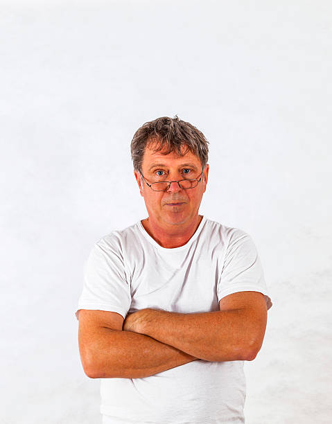 istock Portrait of a smart casual man smiling with hands folded 450714623