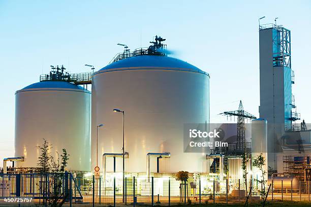 Oil Und Gas Storage Tanks At Dusk Stock Photo - Download Image Now - Chemical, Chemical Plant, Chemistry