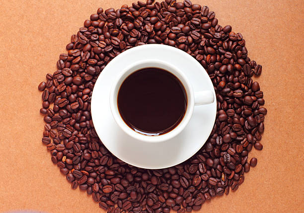 istock White cup of coffee on beans 450727285