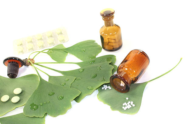 istock Ginkgo leaf with pills and pharmacist bottle 450730143