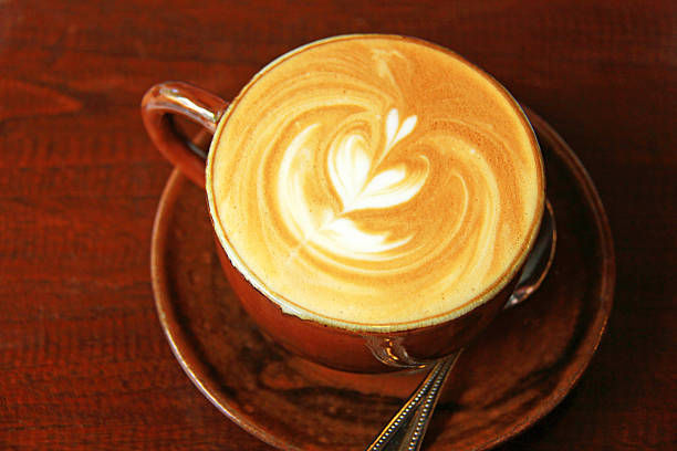 istock Cappuccino or latte coffee with heart shape 450730763