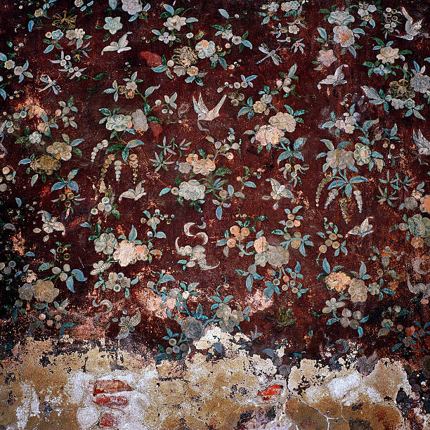 istock Old weathered brick wall and tradition thai painting 450731353