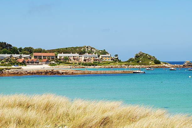 Jetty of Tresco Jetty from Tresco Island, on a beautiful summers day. tresco stock pictures, royalty-free photos & images