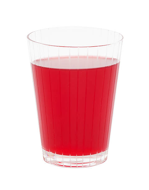 Red cranberry fruit drink One red cranberry fruit drink in the glass. marshwort stock pictures, royalty-free photos & images