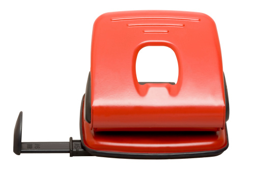 Red hole puncher isolated on the white background