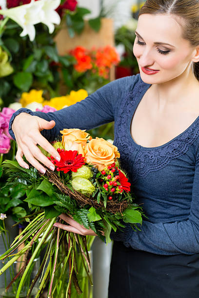 istock Female florist in flower shop 450753063