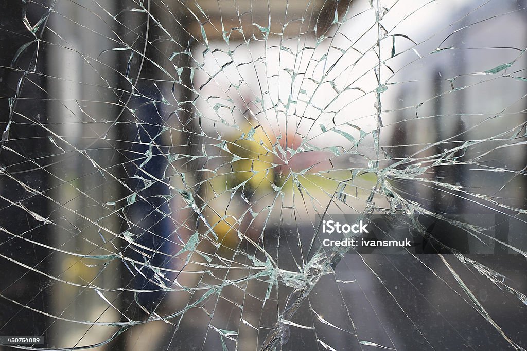 Broken glass Glass broken cracks splinters in front of the bus station Breaking Stock Photo