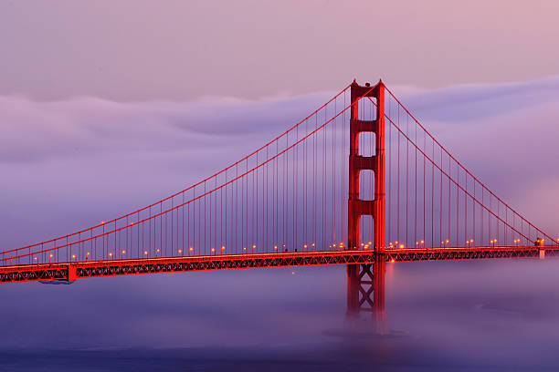 istock Golden Gate bridge with fog at sunset 450757111