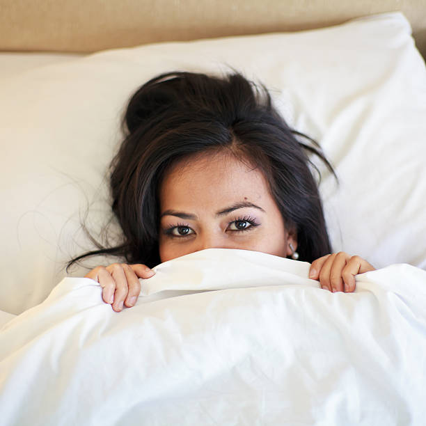 istock Woman lying on the bed 450801301