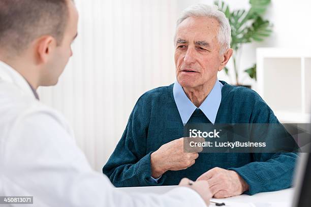 Doctor And An Elderly Patient Stock Photo - Download Image Now - 70-79 Years, Adult, Adults Only