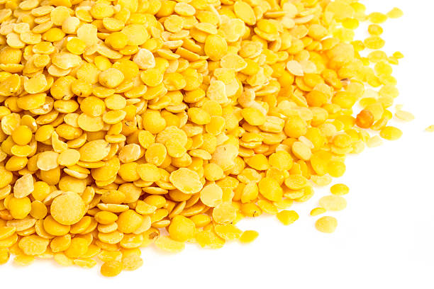 istock Yellow lentils isolated on white background. Macro shot 450813637