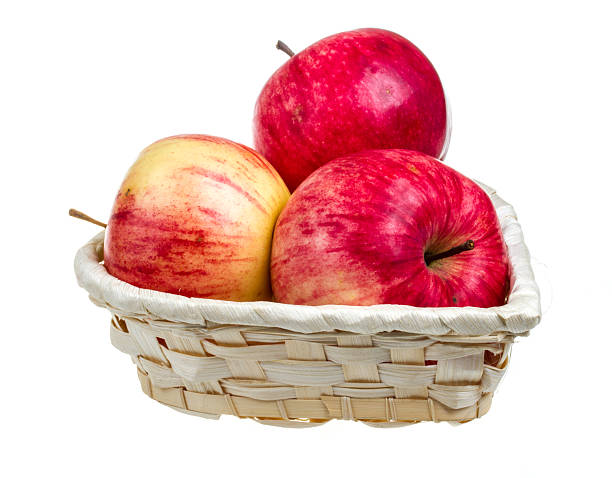 istock fresh red apples in the dish isolated on white background 450813943