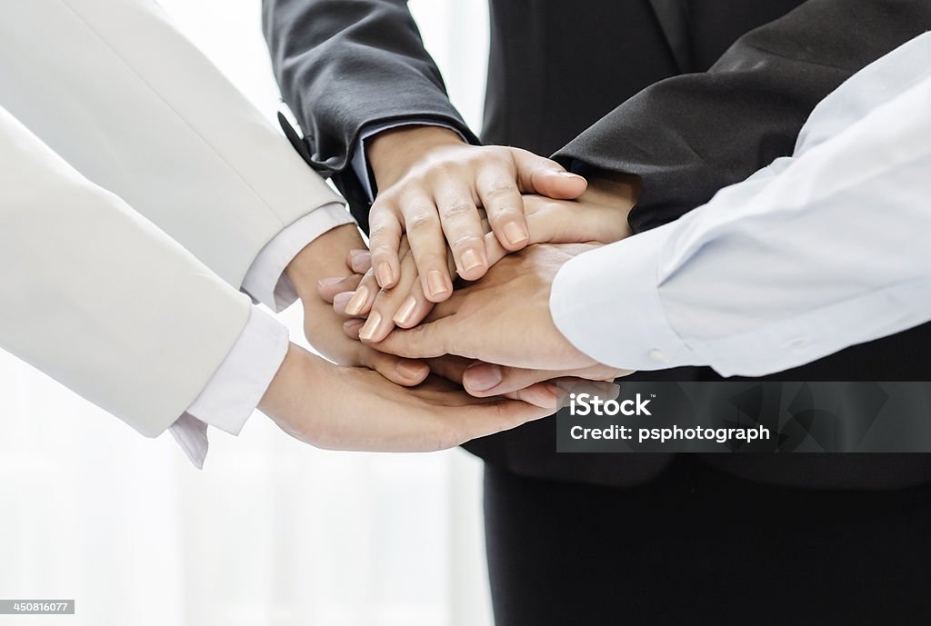 Business team collaboration Business people joining their hands in agreement Achievement Stock Photo