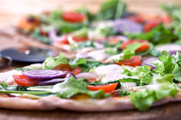 istock Pizza with salad and onion 450816349