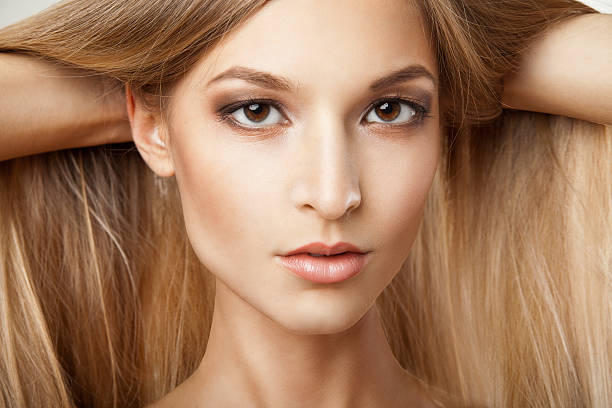 istock Woman with long straight blond hairs 450817443