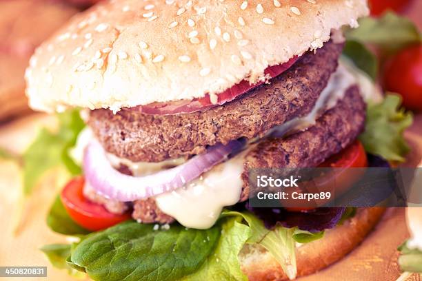 Double Hamburger With Cheese Salad And Onion Stock Photo - Download Image Now - American Culture, Bacon, Beef