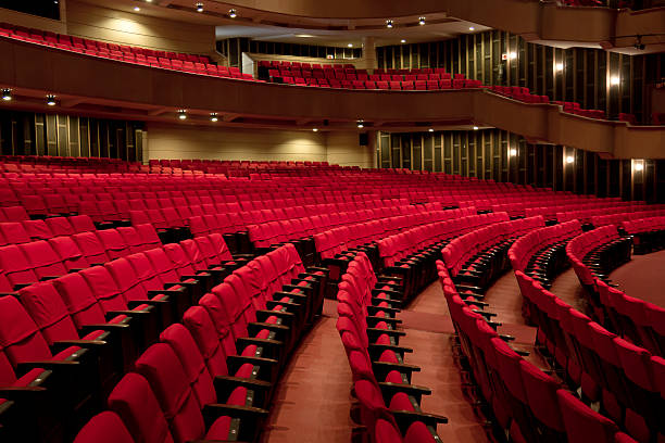 Rows of Empty Seats at a Theatre An empty theatre. The global recession has had a big impact on the arts in many countries around the world. concert hall photos stock pictures, royalty-free photos & images