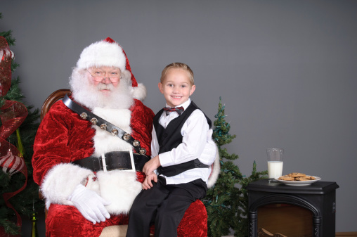 The actual Santa Claus with a child