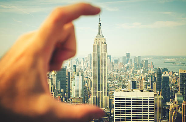 istock empire state building in the hand 450829067