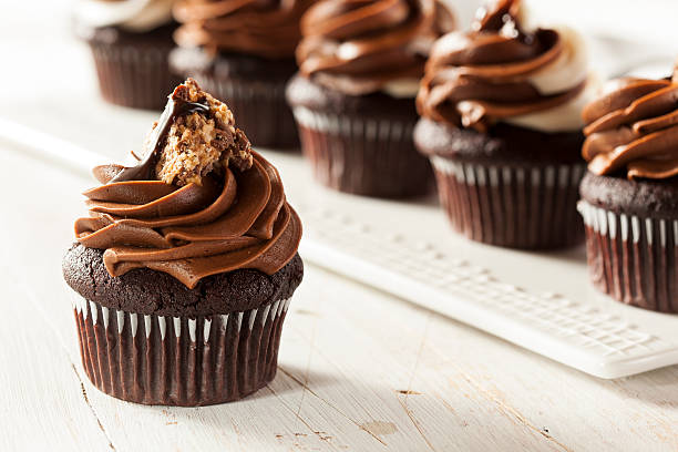 istock Chocolate cupcakes with chocolate frosting and candy topping 450832167