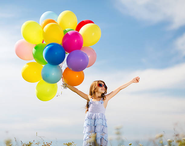 istock happy girl with colorful balloons 450837363