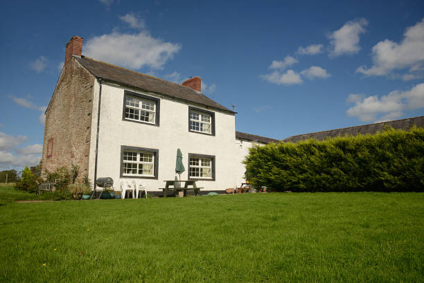 istock Country farm house with lawn 450837767