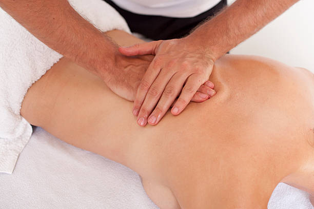 istock Chiropractor giving a back massage to a patient 450843149