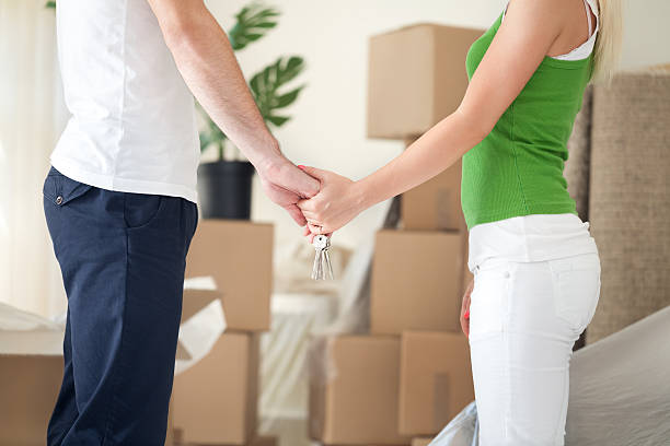 istock couple holding hands in new home 450846443
