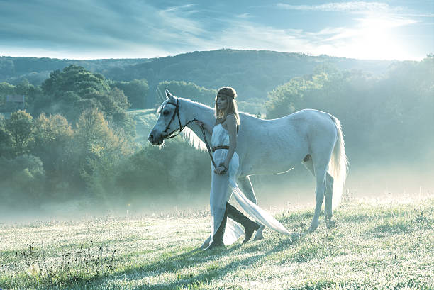istock Beautiful sensual women with white horse 450854583
