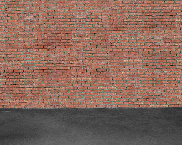 istock Room interior with red brick wall and concrete floor background 450864051