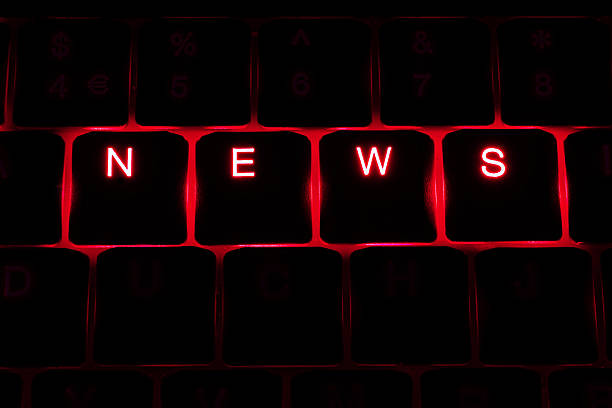 istock 'News' Illuminated Keyboard Text in Red 450864319