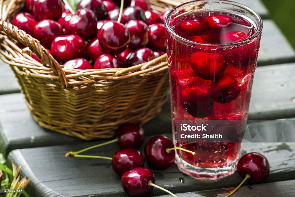 Fresh juice made of sweet cherries and ice Fresh juice made of sweet cherries and ice. Cherry Stock Photo