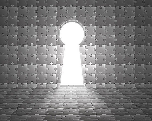 Key shape hole on puzzles wall with bright lighting outside
