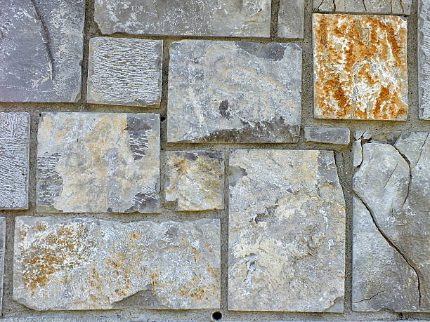 istock Stacked Natural Field Rock Wall Background 450867323