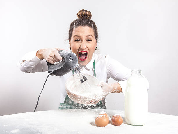 istock Crazy cooking housewife 450872997