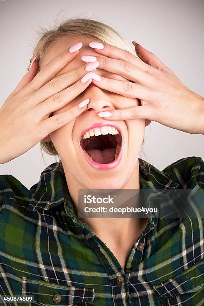 Cant See You Pretty Blond Woman Hiding Behind Her Hands Stock Photo - Download Image Now