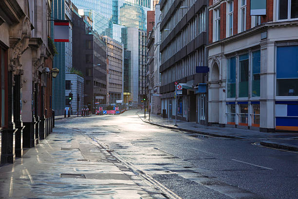 istock Empty London street backlit and wet 450875153