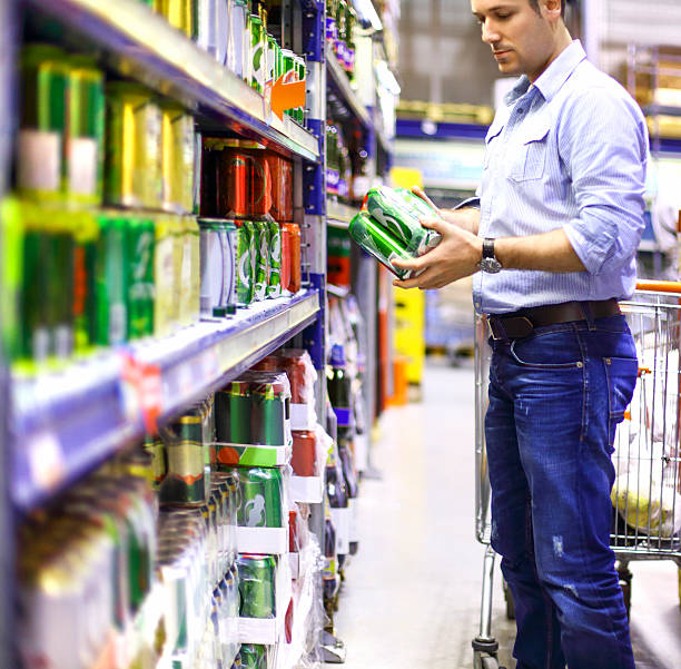 istock Man buying beer in supermarket. 450875549